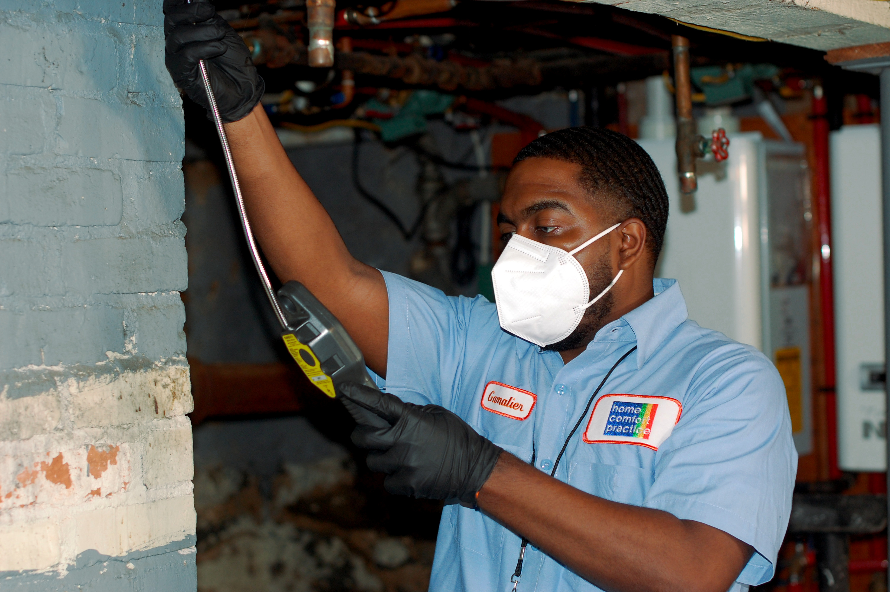 HCP technician conducting an energy assessment inside a Connecticut home