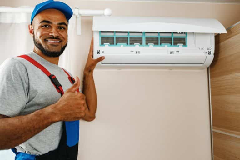 HVAC technician completing an energy upgrade installation