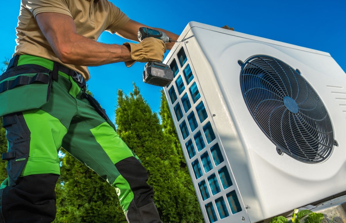 hvac-technician-installing-large-modern-heat-pump-2022-12-16-11-44-02-utc-Medium.jpeg
