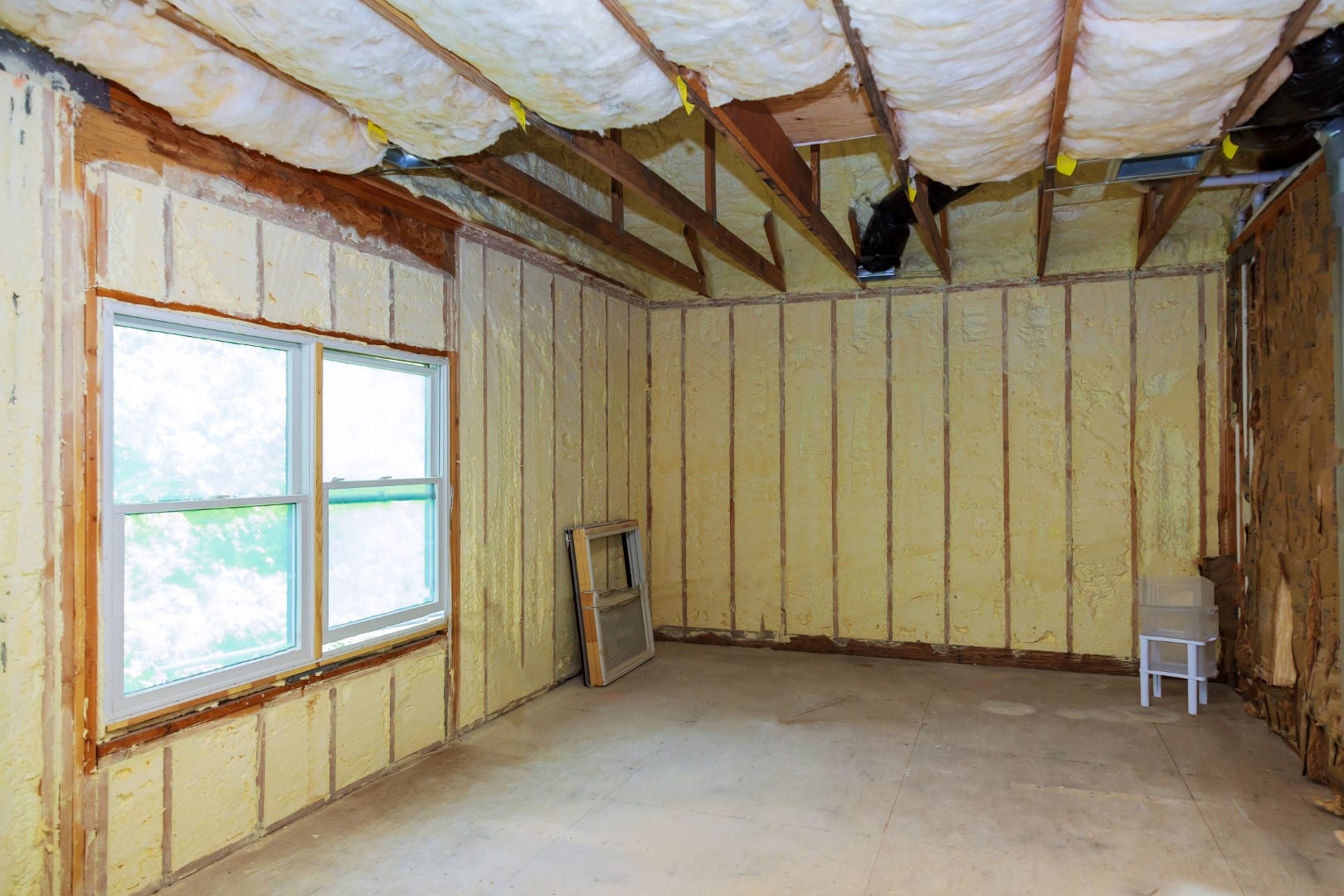 Spray foam insulation applied to basement walls