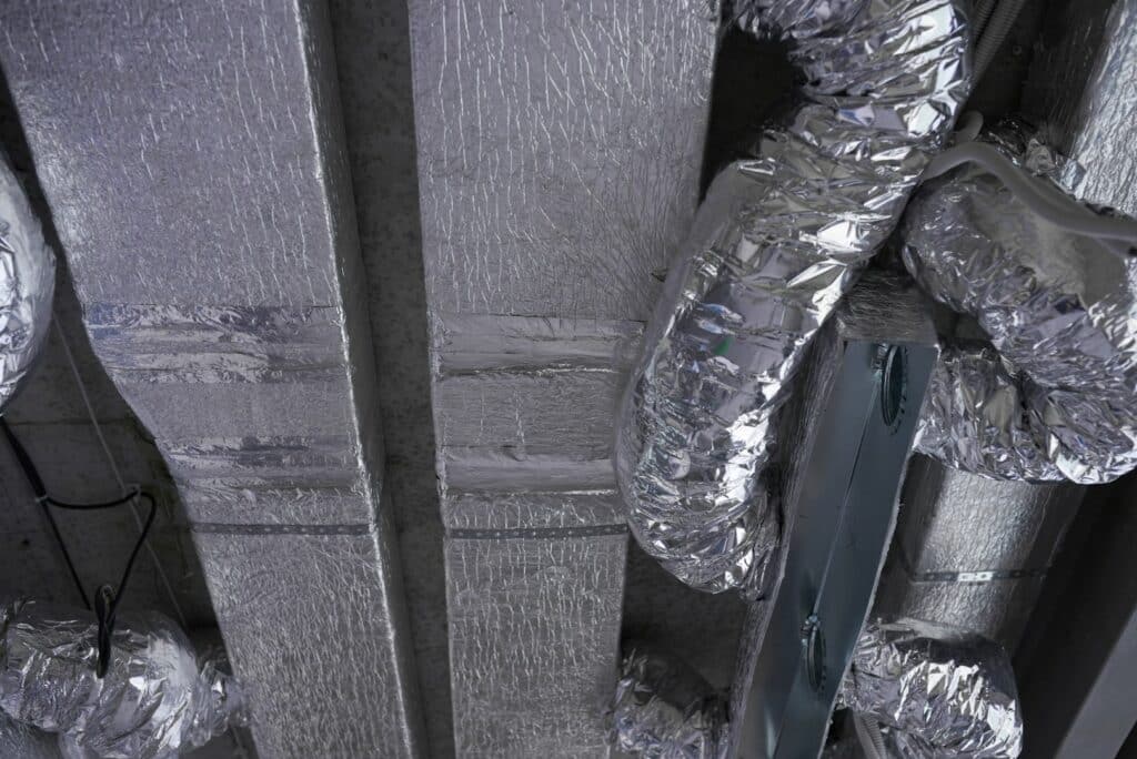 ventilation system in a modern residential apartment during the construction phase, no people