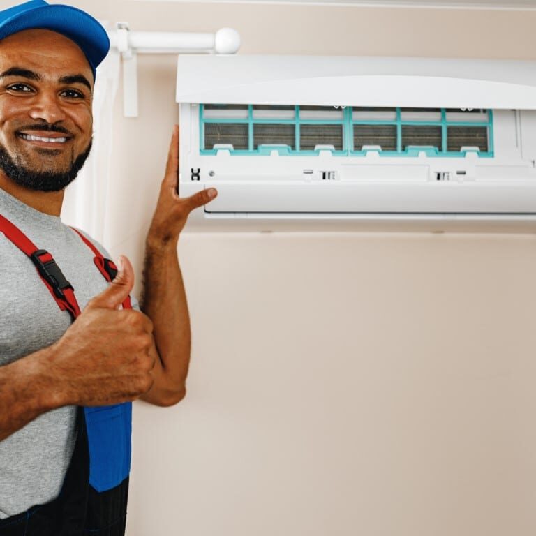 Professional repairman installing air conditioner in a room close up